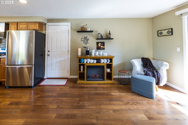 interior space with baseboards, recessed lighting, and wood finished floors