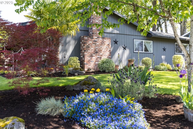 view of property exterior with a lawn