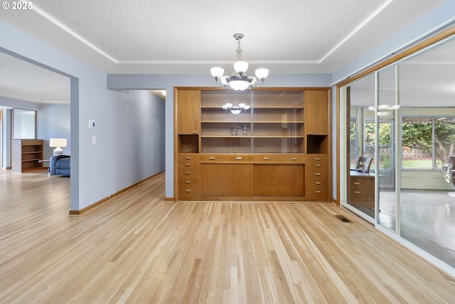 1311 NE 116th Ave, Portland, OR 97220 - unfurnished dining area featuring a chandelier, light wood finished floors, and baseboards
