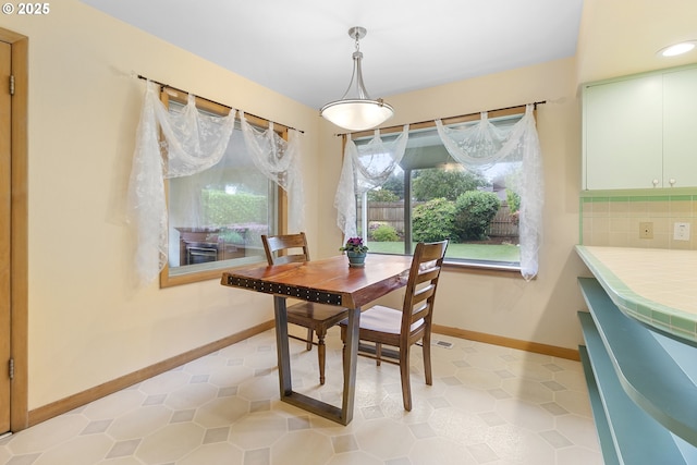 1311 NE 116th Ave, Portland, OR 97220 - dining room featuring light tile patterned flooring, baseboards, and recessed lighting