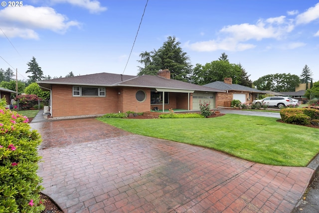 1311 NE 116th Ave, Portland, OR 97220 - ranch-style house with decorative driveway, a front lawn, a garage, brick siding, and a chimney