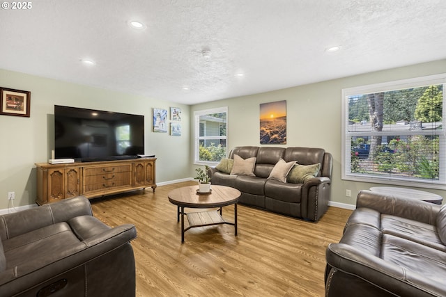 311 S 68th Pl, Springfield, OR 97478 - living area featuring light wood finished floors, a textured ceiling, and recessed lighting
