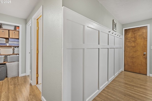 311 S 68th Pl, Springfield, OR 97478 - hallway featuring light wood finished floors and a textured wall