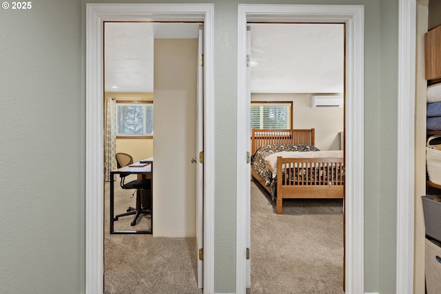 311 S 68th Pl, Springfield, OR 97478 - carpeted bedroom featuring a wall unit AC, an office area, and multiple windows