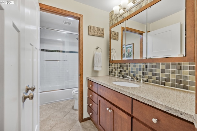 311 S 68th Pl, Springfield, OR 97478 - bathroom featuring vanity, backsplash, enclosed tub / shower combo, and tile patterned floors