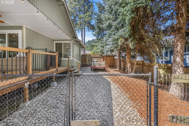 311 S 68th Pl, Springfield, OR 97478 - view of property exterior featuring a gate, a fenced backyard, and a wooden deck
