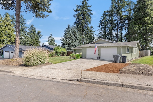 311 S 68th Pl, Springfield, OR 97478 - ranch-style house with a garage, concrete driveway, and a shingled roof