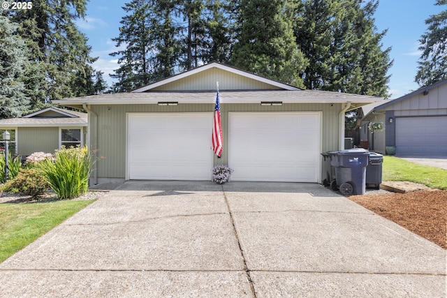 311 S 68th Pl, Springfield, OR 97478 - ranch-style house featuring an outdoor structure and a shingled roof