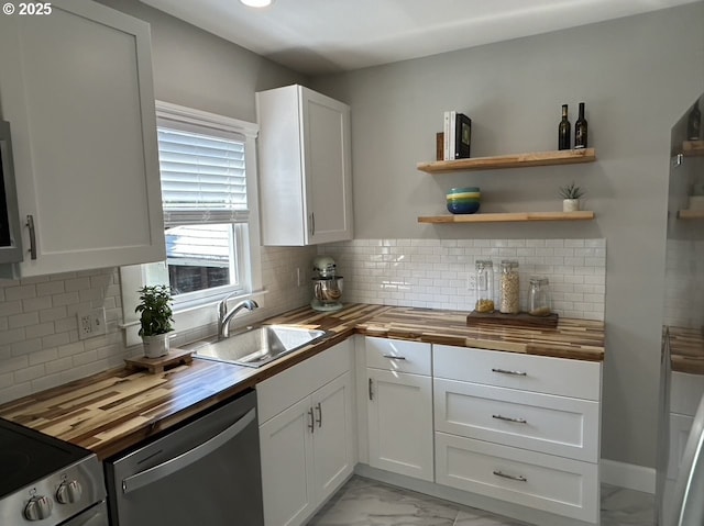 708 W 28th St, Vancouver, WA 98660 - kitchen featuring butcher block countertops, dishwasher, light marble finish floors, and white cabinetry