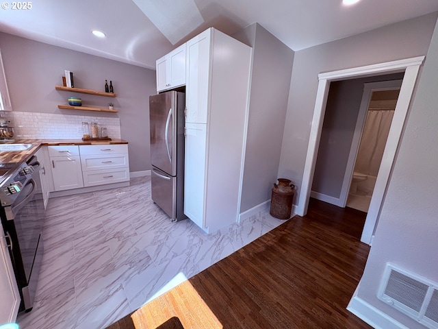 708 W 28th St, Vancouver, WA 98660 - kitchen featuring freestanding refrigerator, white cabinets, decorative backsplash, open shelves, and recessed lighting