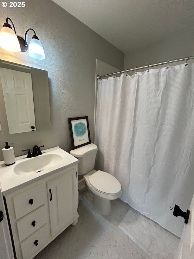 708 W 28th St, Vancouver, WA 98660 - bathroom featuring vanity, a textured wall, and a shower with shower curtain