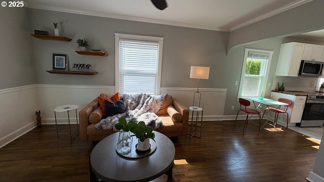 708 W 28th St, Vancouver, WA 98660 - living area featuring wood finished floors, crown molding, and wainscoting