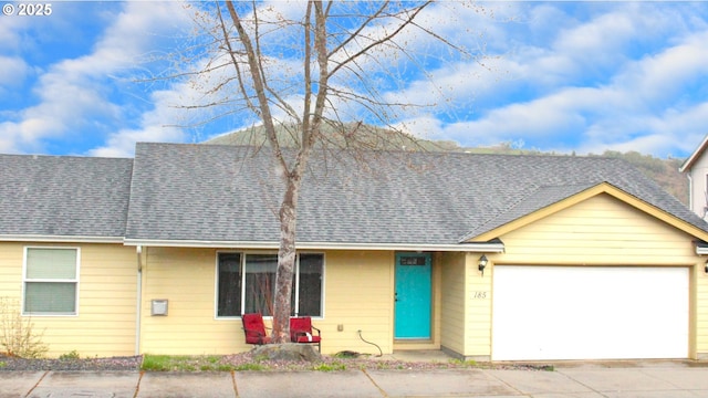 185 SE Lebleu Ln, Winston, OR 97496 - view of front of home featuring a shingled roof and an attached garage