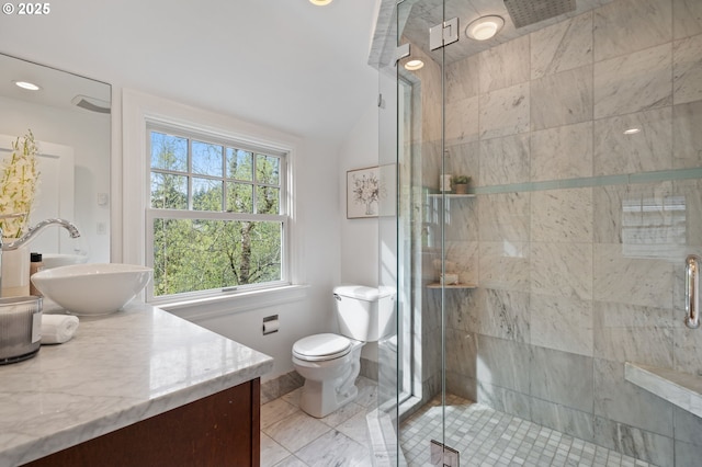full bath featuring toilet, lofted ceiling, vanity, and a shower stall