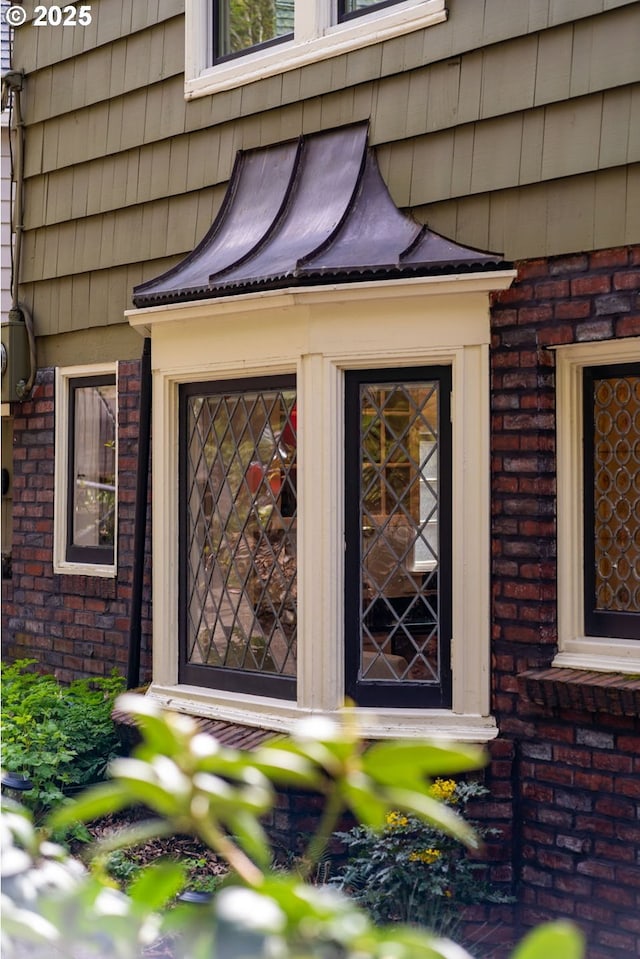 exterior space featuring brick siding