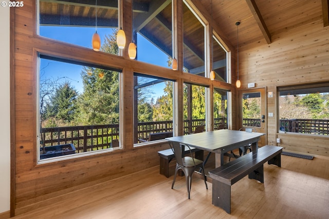 sunroom / solarium with lofted ceiling with beams and wooden ceiling