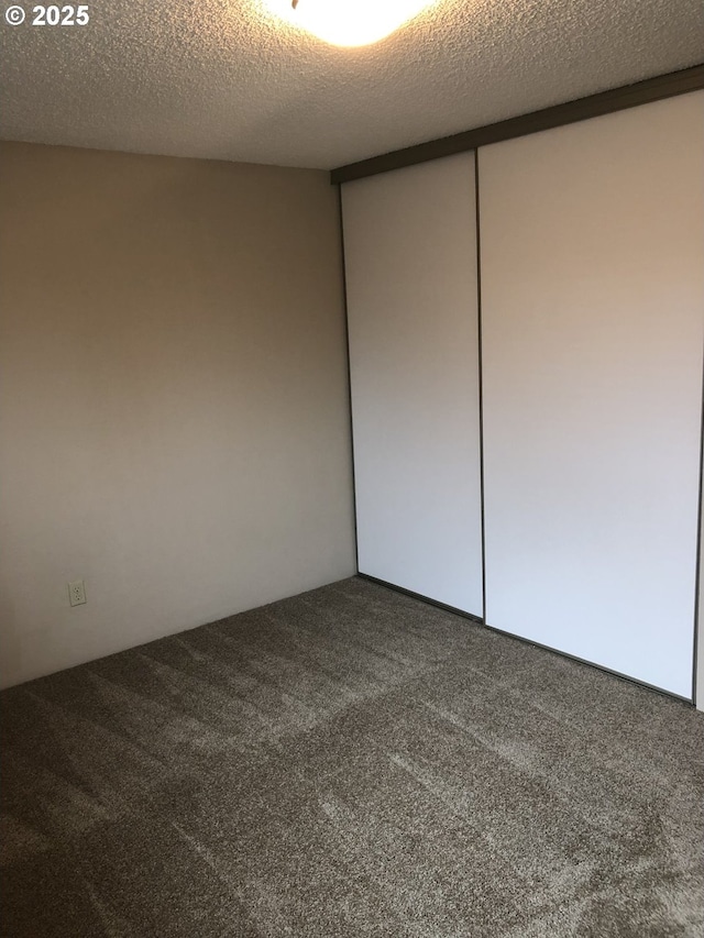 323 S Locust St, Canby, OR 97013 - carpeted spare room featuring a textured ceiling