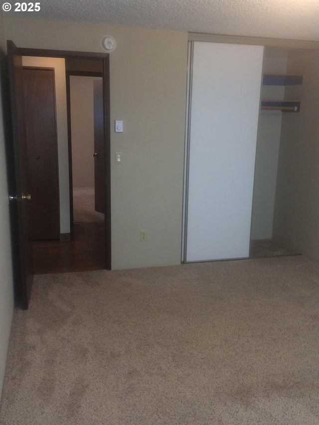 323 S Locust St, Canby, OR 97013 - unfurnished bedroom featuring carpet and two closets