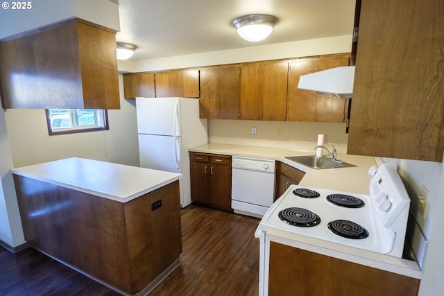 323 S Locust St, Canby, OR 97013 - kitchen with white appliances, ventilation hood, dark wood-type flooring, light countertops, and brown cabinets
