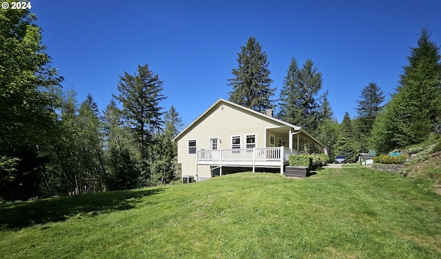 27915 NE Thompson Cir, Yacolt, WA 98675 - rear view of property with a lawn and a wooden deck