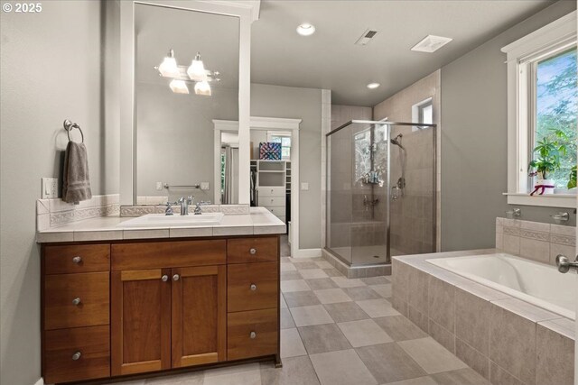 12521 NW Jackson Quarry Rd, Hillsboro, OR 97124 - full bathroom featuring a shower stall, a bath, vanity, recessed lighting, and tile patterned floors