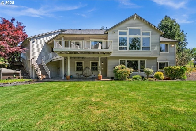 12521 NW Jackson Quarry Rd, Hillsboro, OR 97124 - rear view of house featuring a yard, a deck, stairway, and a patio