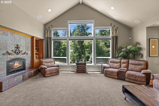 12521 NW Jackson Quarry Rd, Hillsboro, OR 97124 - carpeted living area with a tiled fireplace, healthy amount of natural light, high vaulted ceiling, and recessed lighting