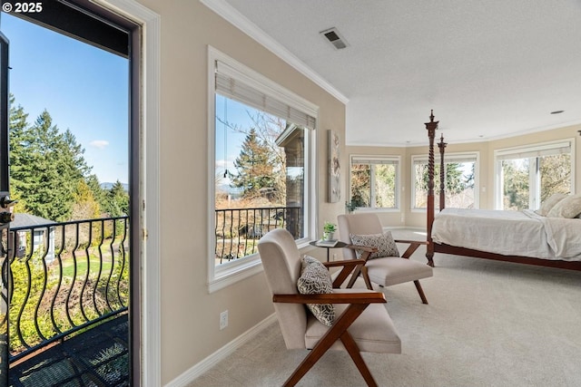 carpeted bedroom with access to outside, visible vents, baseboards, and ornamental molding