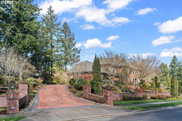 exterior space with concrete driveway and sidewalks