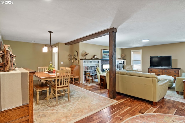 5583 54th Ct, Salem, OR 97317 - dining area with wood finished floors, a chandelier, and a textured ceiling