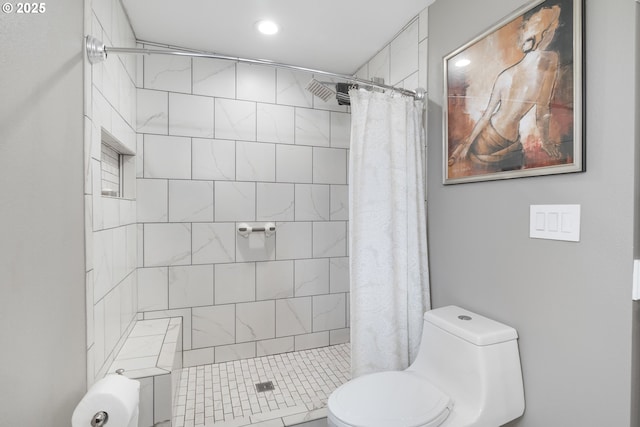 bathroom featuring curtained shower and toilet