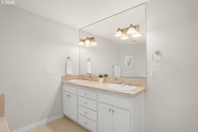 10494 NW Forestview Way, Portland, OR 97229 - bathroom featuring double vanity, baseboards, and tile patterned flooring