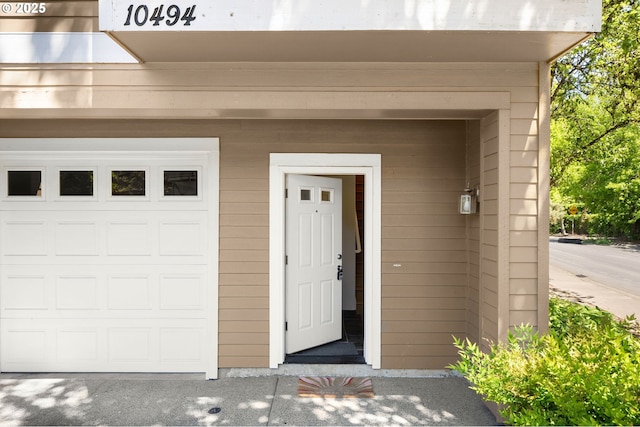 10494 NW Forestview Way, Portland, OR 97229 - view of exterior entry featuring a garage