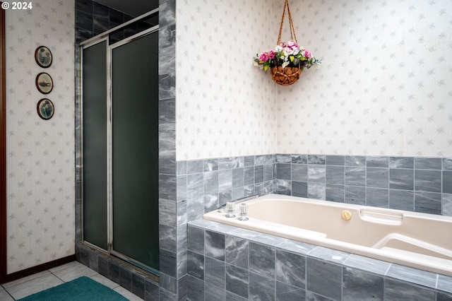 full bathroom with wallpapered walls, a shower stall, a bath, and tile patterned floors