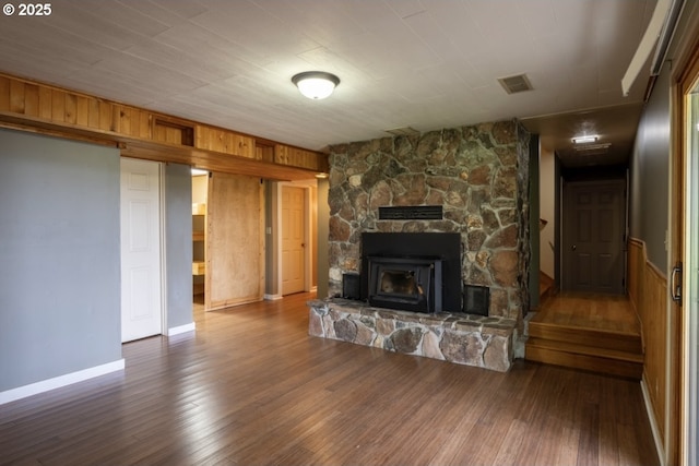 unfurnished living room featuring hardwood / wood-style flooring and a fireplace