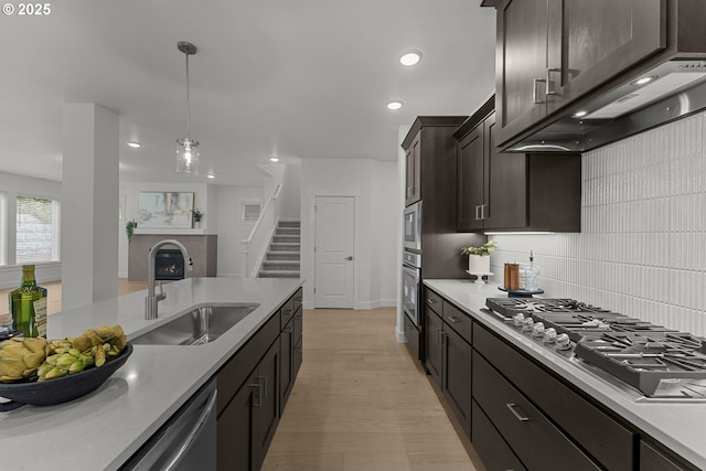 15129 SW Huntwood St, Tigard, OR 97224 - kitchen featuring a sink, stainless steel appliances, backsplash, light countertops, and recessed lighting
