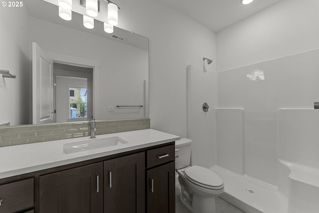 15129 SW Huntwood St, Tigard, OR 97224 - full bathroom with backsplash, a shower, toilet, and vanity