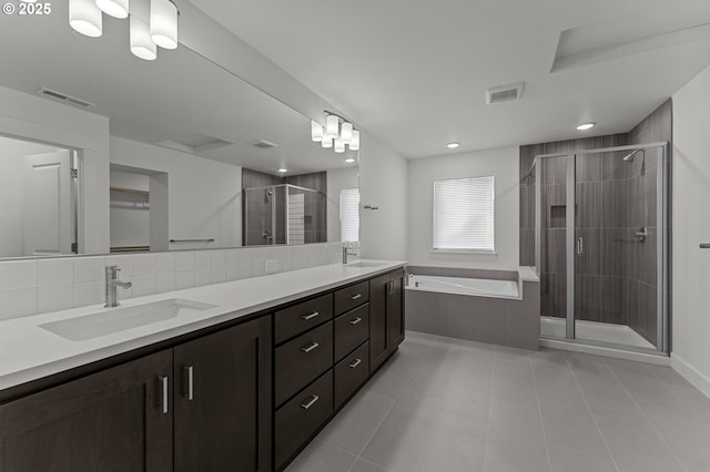 15129 SW Huntwood St, Tigard, OR 97224 - bathroom with a shower stall, a garden tub, tile patterned flooring, double vanity, and recessed lighting