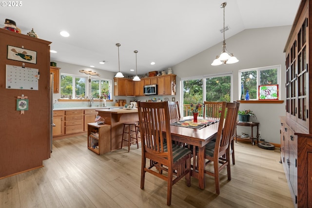 1395 Dooley Ln, Gearhart, OR 97138 - dining room featuring light wood-style flooring, a chandelier, vaulted ceiling, and recessed lighting