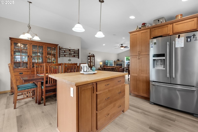 1395 Dooley Ln, Gearhart, OR 97138 - kitchen featuring high quality fridge, light wood finished floors, a ceiling fan, decorative light fixtures, and recessed lighting