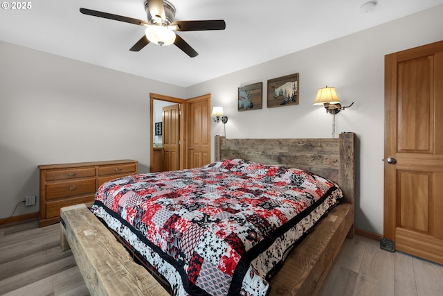 1395 Dooley Ln, Gearhart, OR 97138 - bedroom featuring light wood-type flooring and ceiling fan
