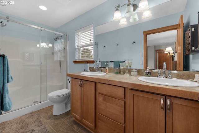 1395 Dooley Ln, Gearhart, OR 97138 - bathroom with a chandelier, a shower stall, double vanity, and tile patterned flooring
