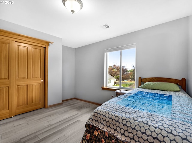 1395 Dooley Ln, Gearhart, OR 97138 - bedroom featuring light wood-style flooring and baseboards
