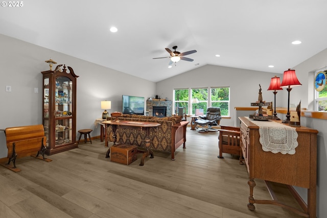 1395 Dooley Ln, Gearhart, OR 97138 - living area with a ceiling fan, lofted ceiling, light wood-style flooring, a stone fireplace, and recessed lighting