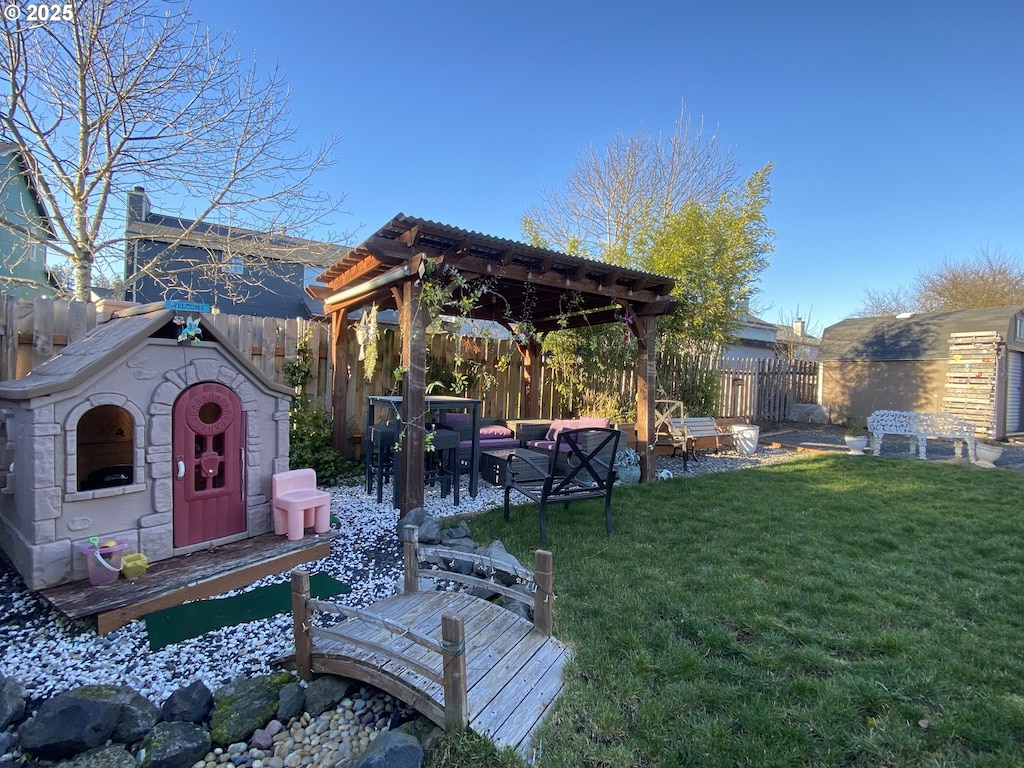 view of yard with a fenced backyard and a pergola