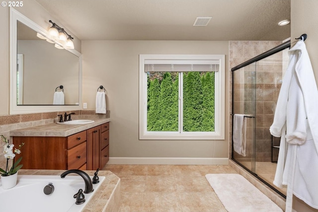 8967 SW 184th Dr, Beaverton, OR 97007 - bathroom with vanity, a shower stall, a bath, and tile patterned flooring