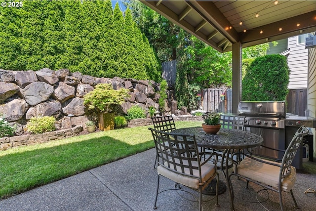 8967 SW 184th Dr, Beaverton, OR 97007 - view of patio featuring a grill and outdoor dining space