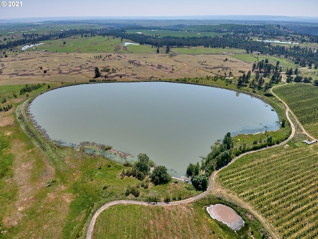 drone / aerial view with a rural view and a water view