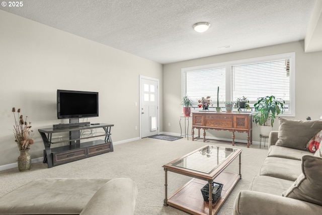 carpeted living room with a textured ceiling