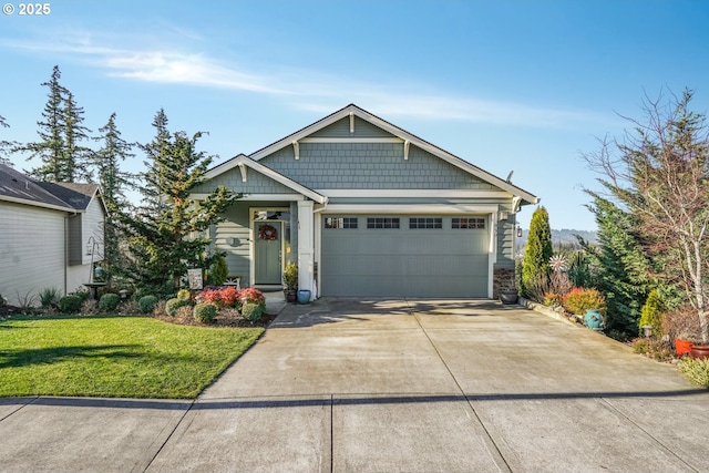 view of front facade with a garage and a front yard